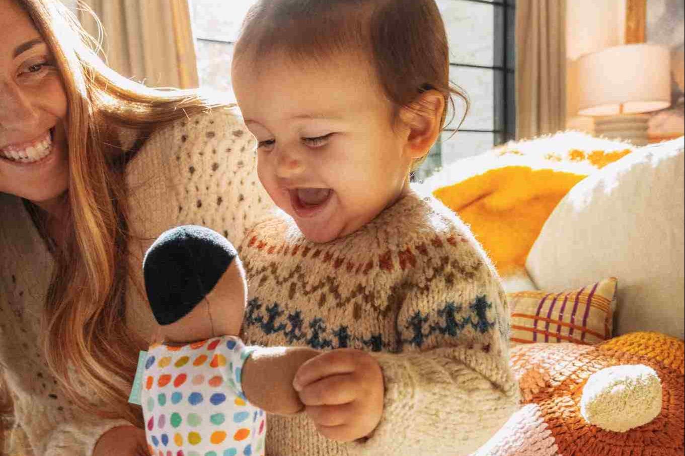 Baby playing with the Organic Cotton Baby Doll from The Thinker Play Kit