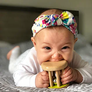 Baby with the Rolling Bell from The Charmer Play Kit